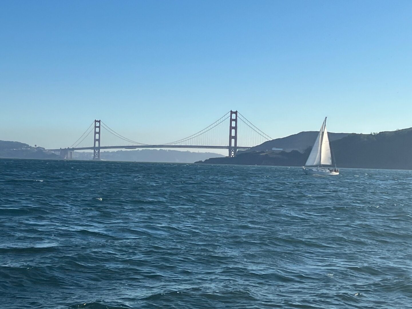 Sailboat in front of Golden Gate Bridge